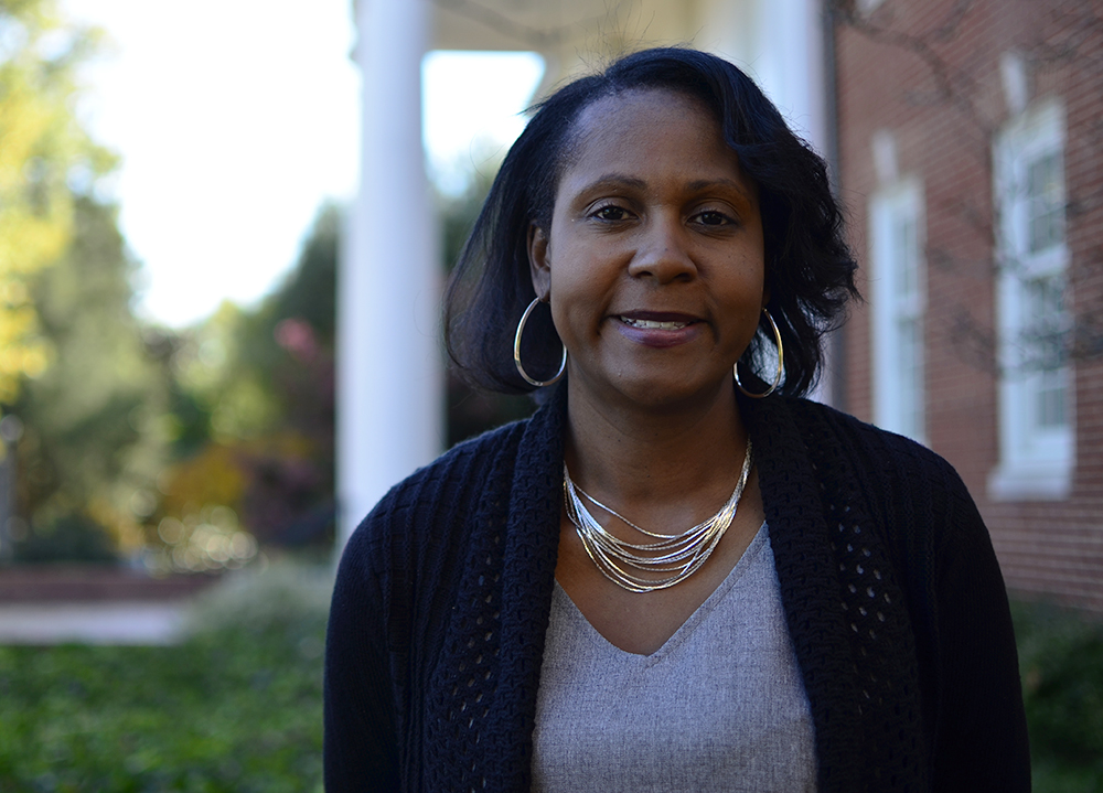 Dr. Tracey Ray standing outside Winslow Hall