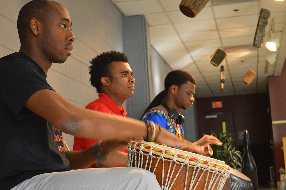 Drummers Kevin Ohuoba, a sophomore studying accounting,Carlos McClaney, a senior studying technology design and engineering education, and Ade Adesina, a sophomore in Exploratory Studies, perform the ceremonial welcome, Call of the Drums, during the annual Harambee celebration held in Witherspoon's Sankofa Room on Tuesday, September 1, 2015.